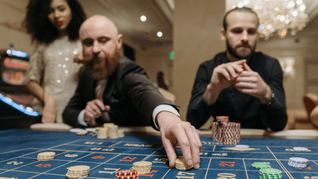 A man playing roulette in a casino.