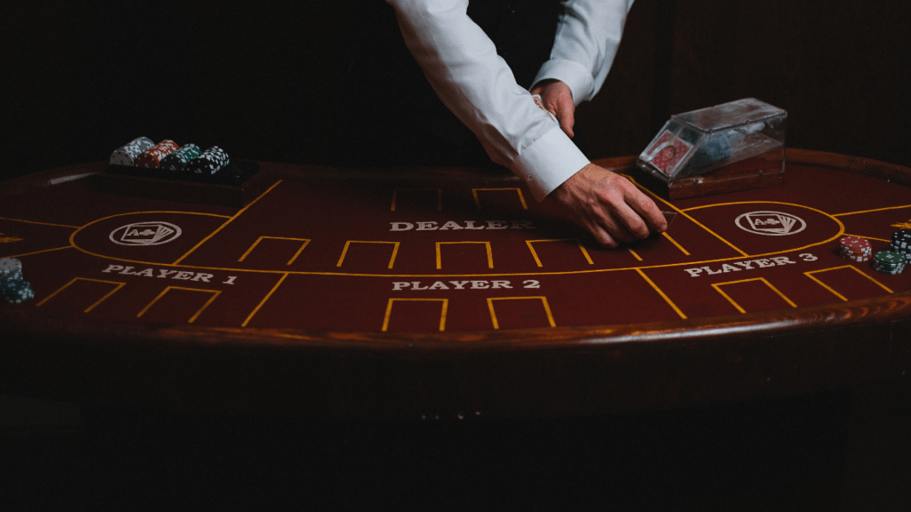 A person playing blackjack at a casino table