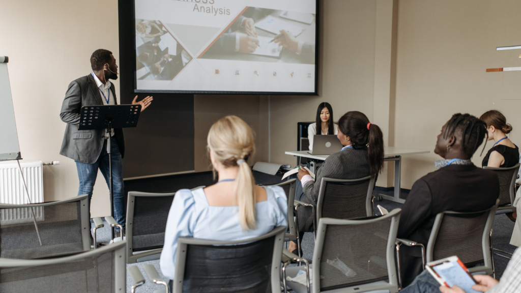 a person giving a presentation in front of a group of people