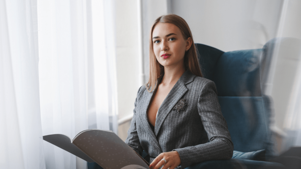 A stylish businesswoman holding an open book