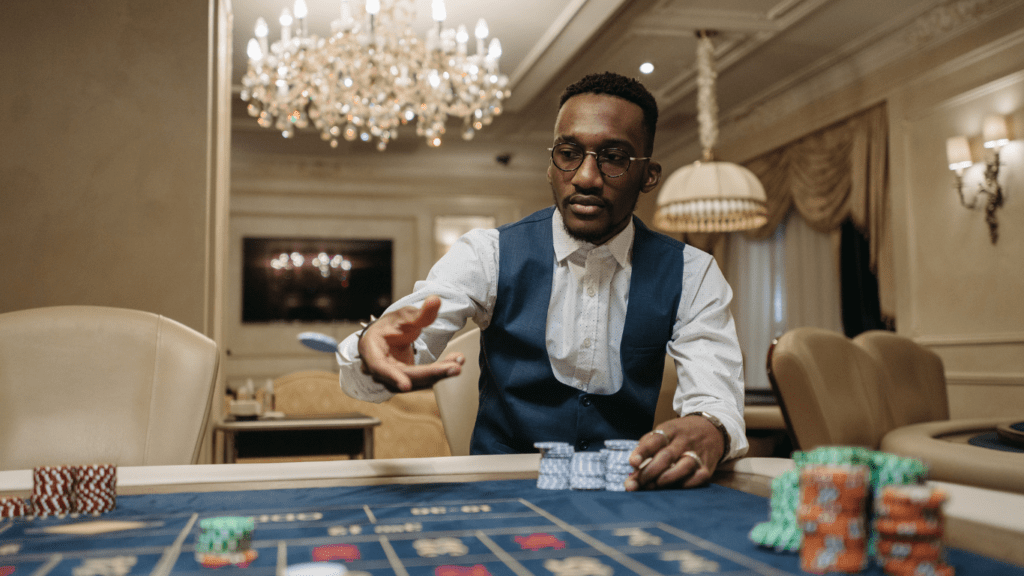 A man playing roulette in a casino.