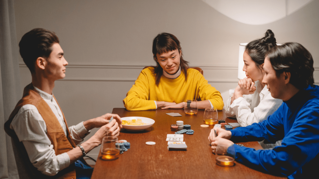 a group of people playing poker at a casino table