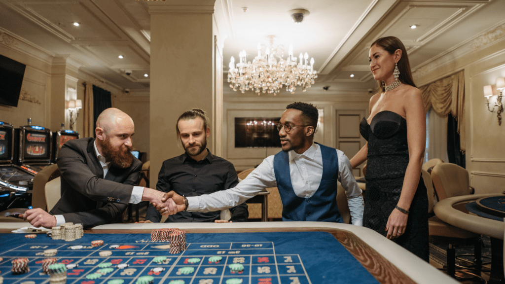 a group of people playing roulette at a casino table