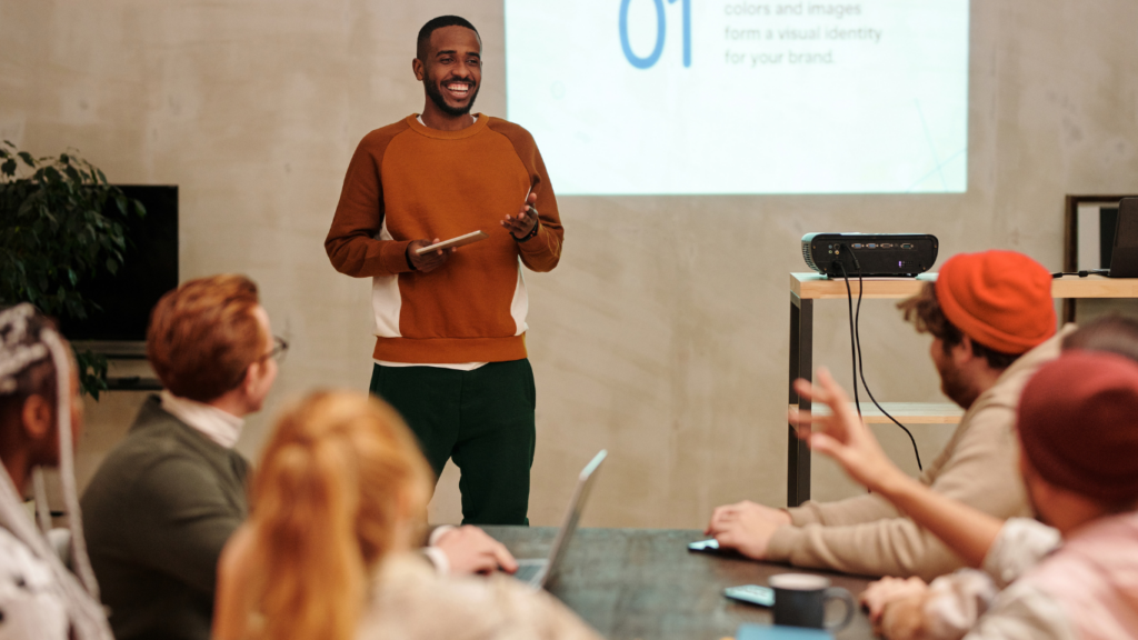 a person giving a presentation in front of a group of people