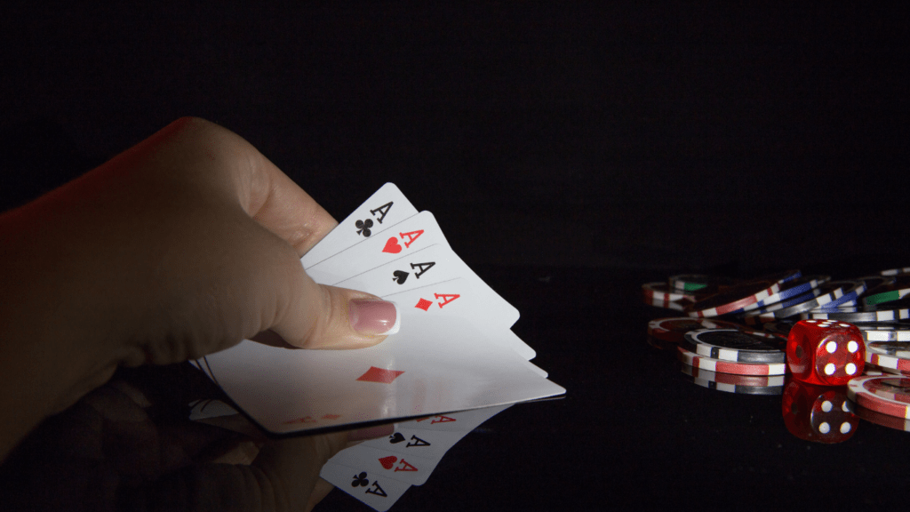 a person holding a playing card