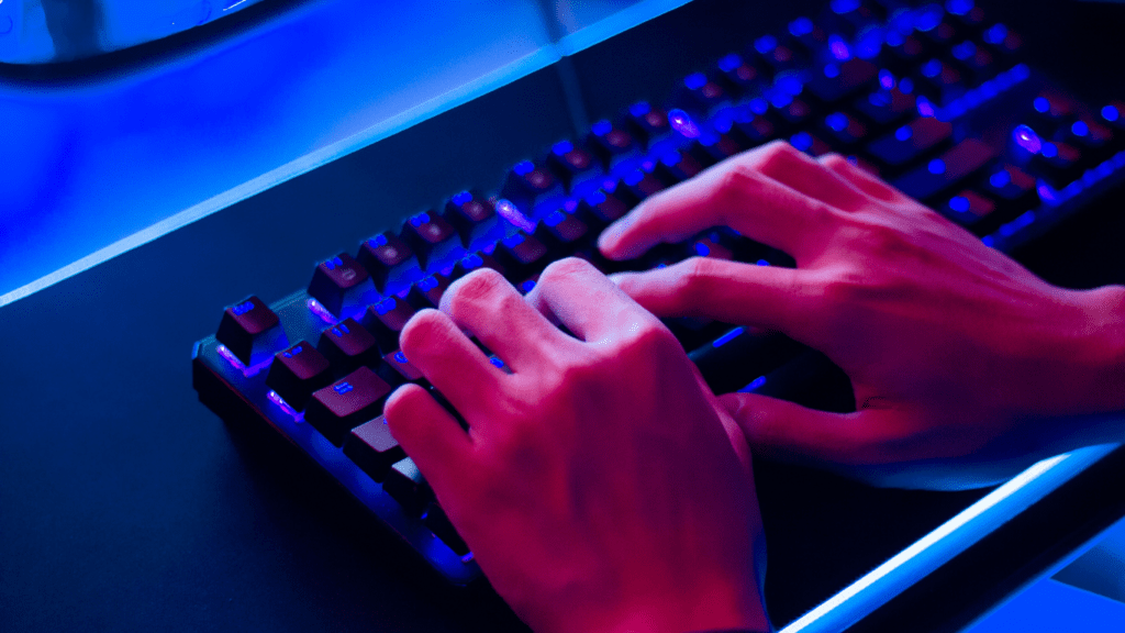 a person typing on keyboard